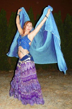 Photo of Carmela Senior belly dancing. 