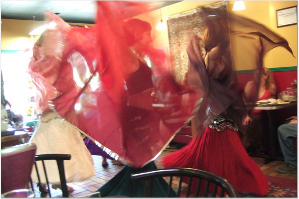 Photo of Banat Mara, a belly dance troupe, dancing.