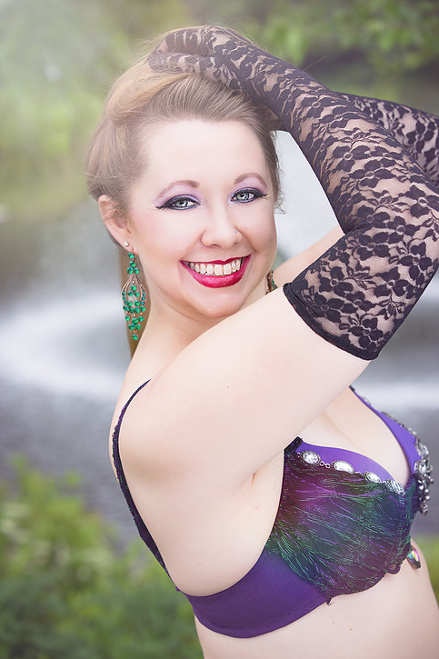 Meg Morley in purple belly dance costume.